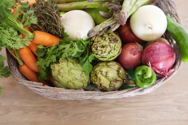 basket with various healthy and organic vegetables