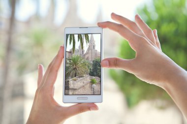 woman taking pictures of a monument