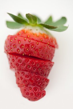 one bright red strawberry sliced