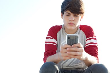 boy holding and using a smartphone