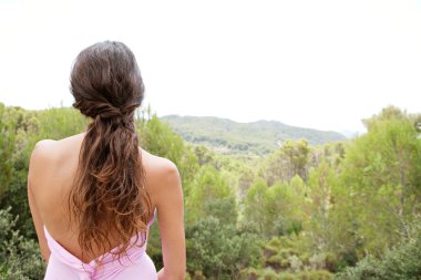 young woman relaxing in the forest mountains