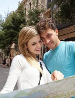 tourist couple reading a map