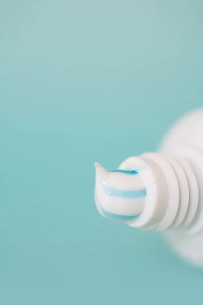 Toothpaste pouring out of a tooth pase tube — 图库照片