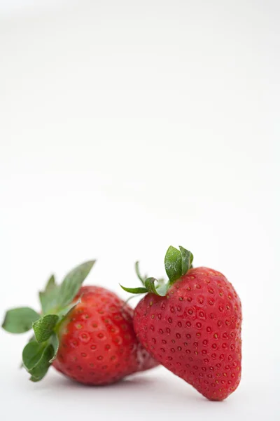 Red strawberries leaning together — Stock Photo, Image