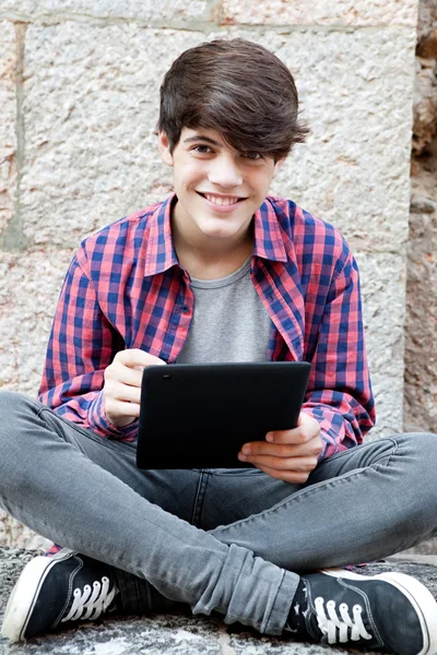 Boy using a digital tablet pad — 图库照片