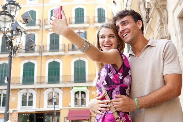 Couple relaxing and taking a selfie picture of themselves — Stockfoto