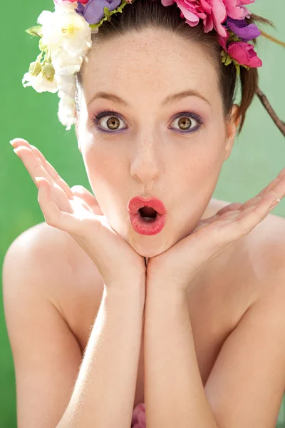 Woman wearing a spring flowers hair dress — Stok fotoğraf