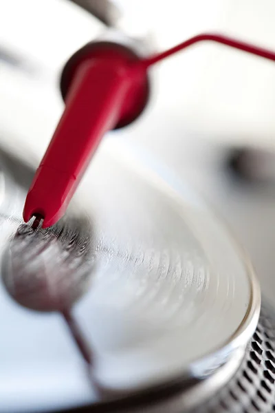 Record player with a needle touching — Stok fotoğraf