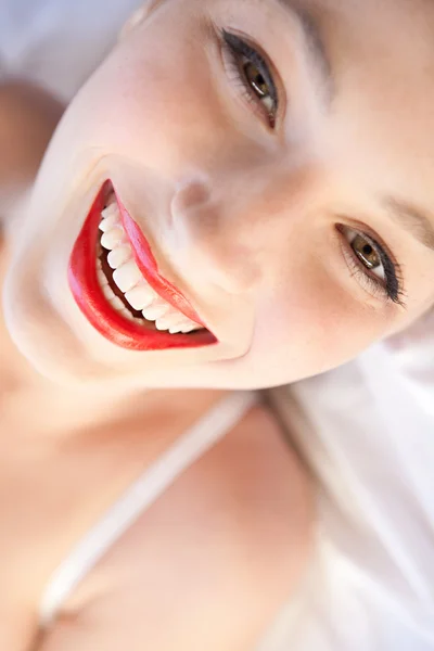 Sexy girl laying on a bed — Stok fotoğraf