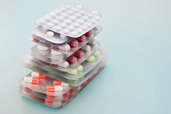 Pile of prescription pills and capsules medicine packs — ストック写真