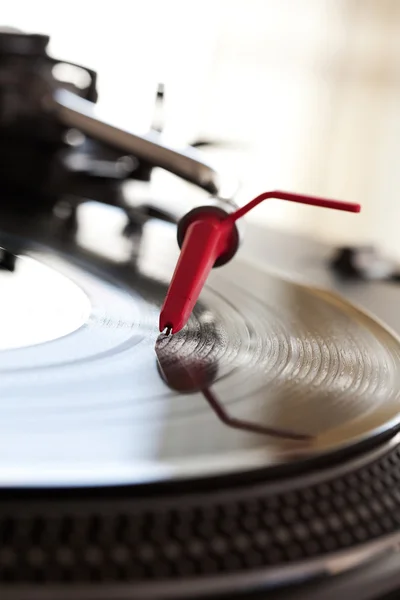 Record player with a needle touching — Stok fotoğraf