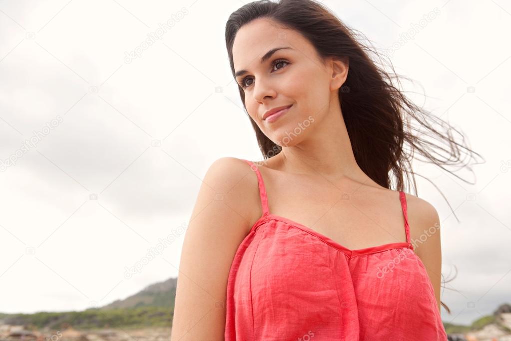 portrait of a young woman relaxing on a beach