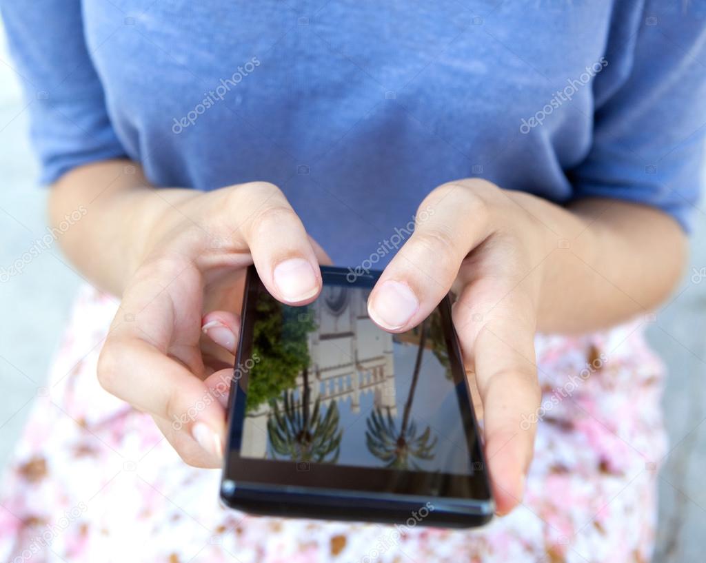 woman using a touch screen smartphone