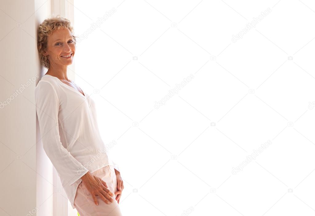 business woman leaning on a wall