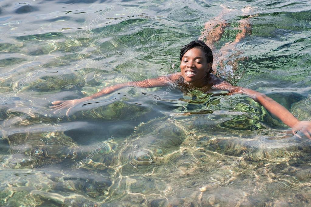 Naked Woman Swimming In Water