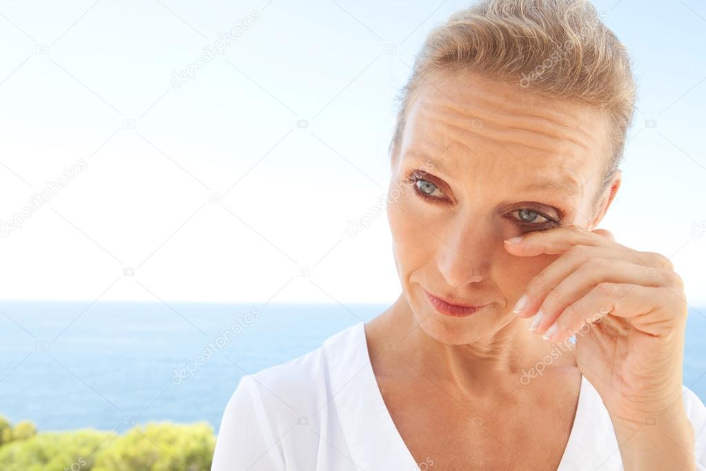 portrait of a woman looking worried and emotional