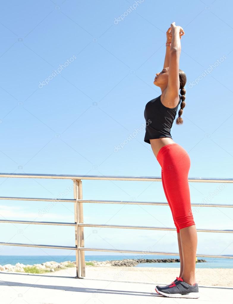 woman stretching while exercising
