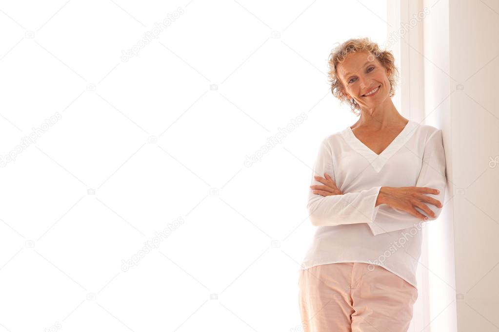 business woman leaning on a wall