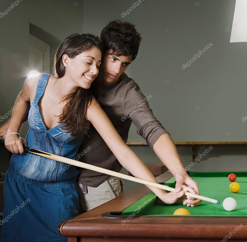 Couple playing pool in a bar — Stock Photo © mjth 79456136