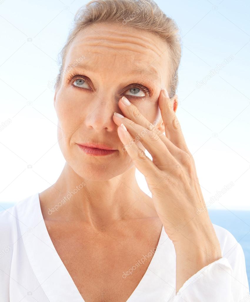 portrait of a woman looking worried and emotional