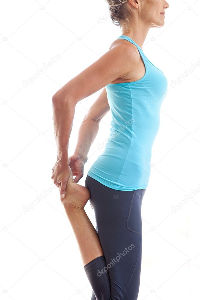 woman exercising and stretching her legs and body