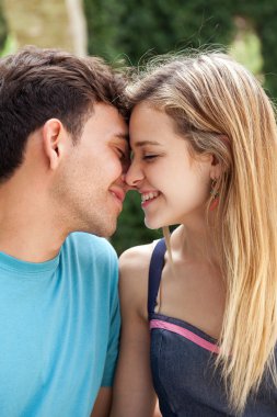 attractive couple kissing and smiling