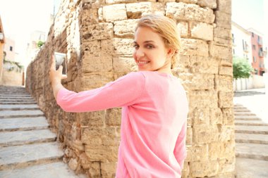 woman take pictures in the old city