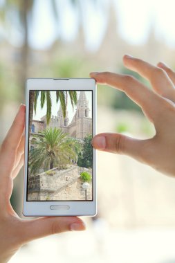 woman taking pictures of a monument