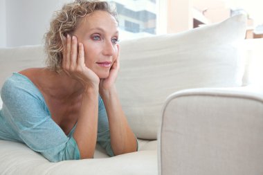 woman on a white sofa at home