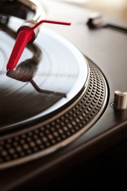 record player with a needle touching