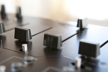DJ mixing deck wtih buttons and control slides