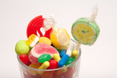 glass jar container with candy sweets and jelly beans