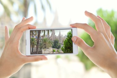 woman taking pictures of a monument