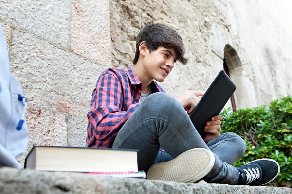 School boy using a digital tablet — Zdjęcie stockowe