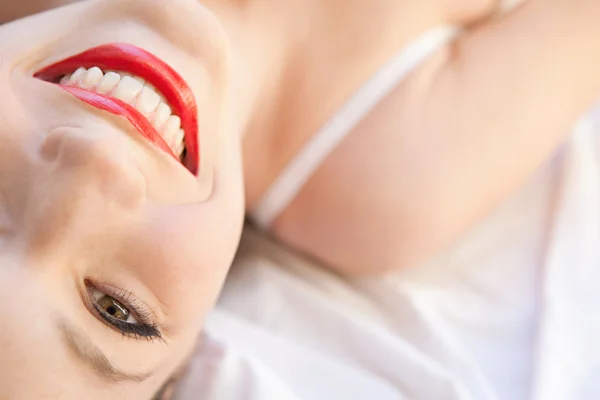 Sexy girl laying on a bed — Stock fotografie