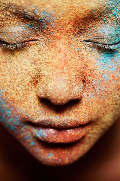 girl face with makeup powder pigment and glitter