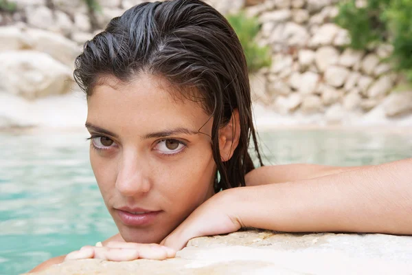 Woman in a spa swimming pool — Stockfoto