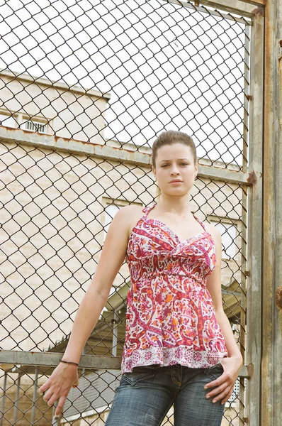 Girl standing by a college campus playground — Stock Photo, Image