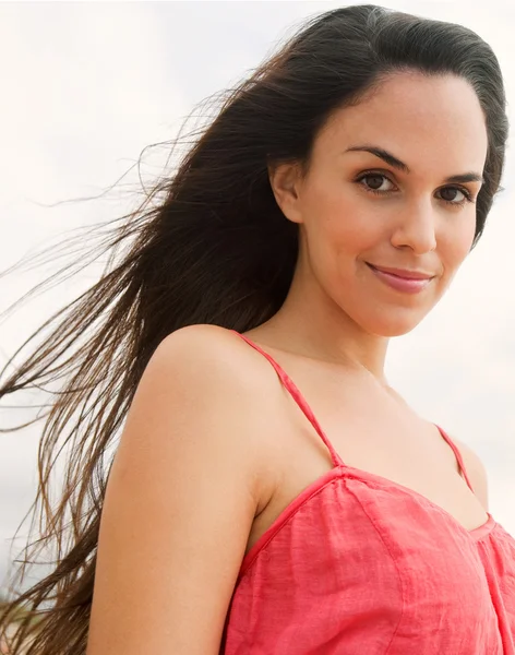 Portrait of a young woman relaxing on a beach — Stok fotoğraf