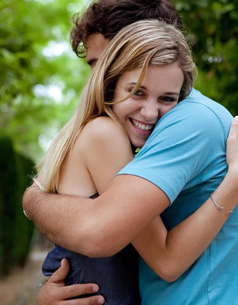 Couple embracing with joyful expressions — Stockfoto