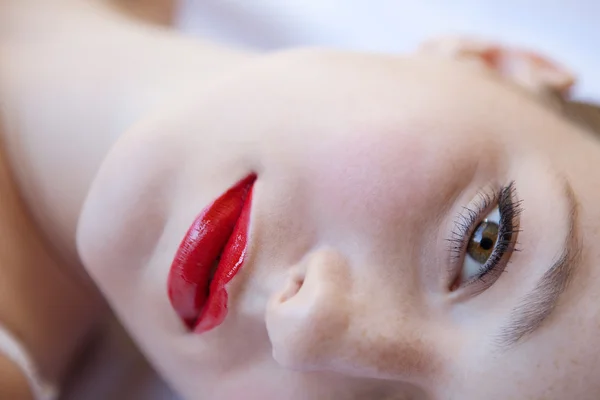 Sexy girl laying on a bed — Stock Photo, Image