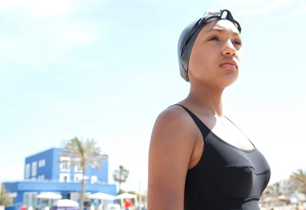 Young woman swimmer on a beach — 图库照片