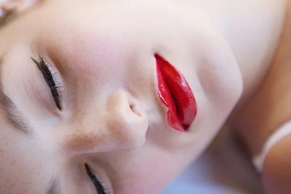 Sexy girl laying on a bed — Stok fotoğraf