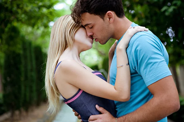 Romantic young couple kissing and embracing Royalty Free Stock Images