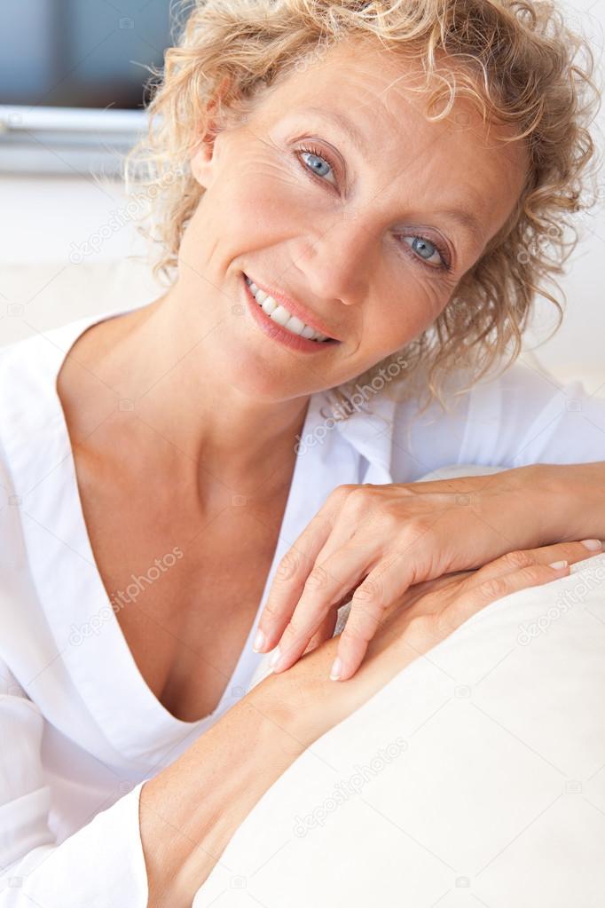 Portrait of mature woman relaxing at home