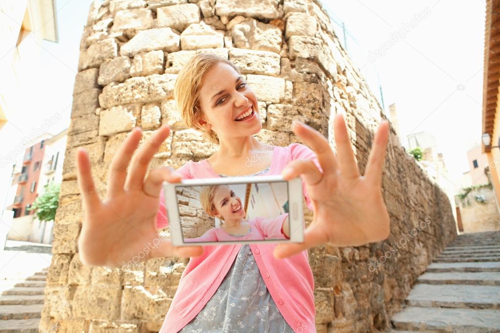 woman take selfies pictures in the old city