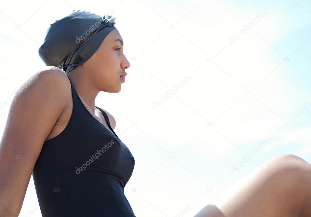 teenager girl swimmer on a beach