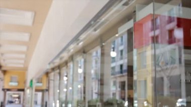 woman walking along a shopping center in the city