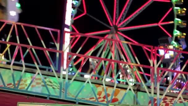 Ride coming in and out of frame at a fun fair — Stock Video