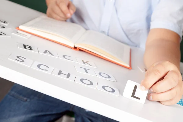 Boy in a shirt with school boards — Stock Photo, Image